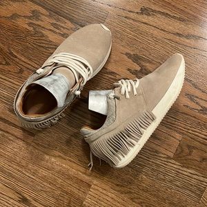 Esseutesse’s Suede Fringe Sneakers